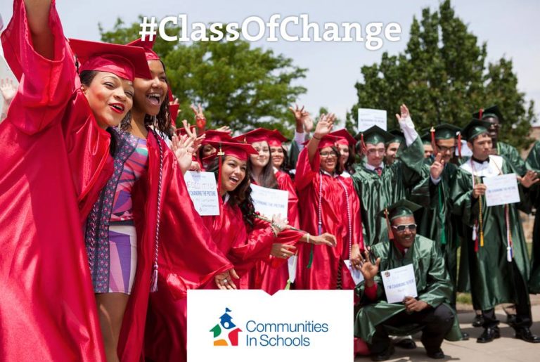 group of graduating high school seniors with #classofchange signs