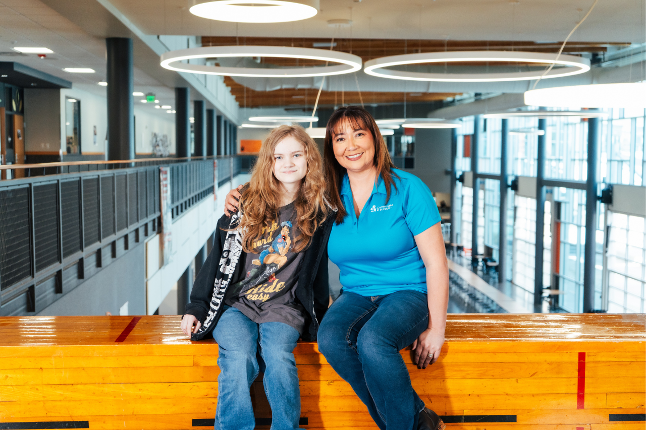  Site coordinator sitting next to student