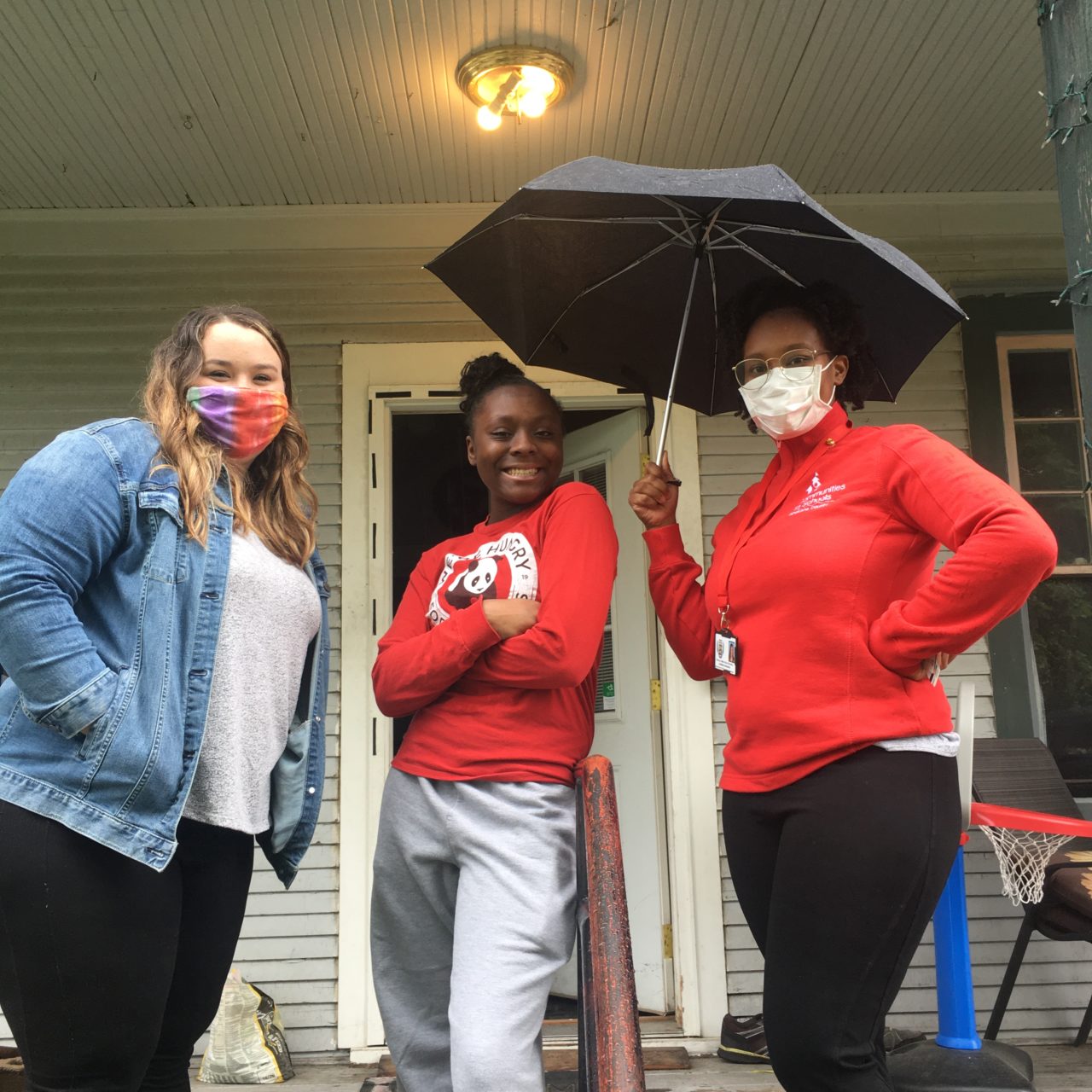 CISSC Site Coordinators, Sarah and Shamerica, pose with a 2020 graduate from North Central High School.