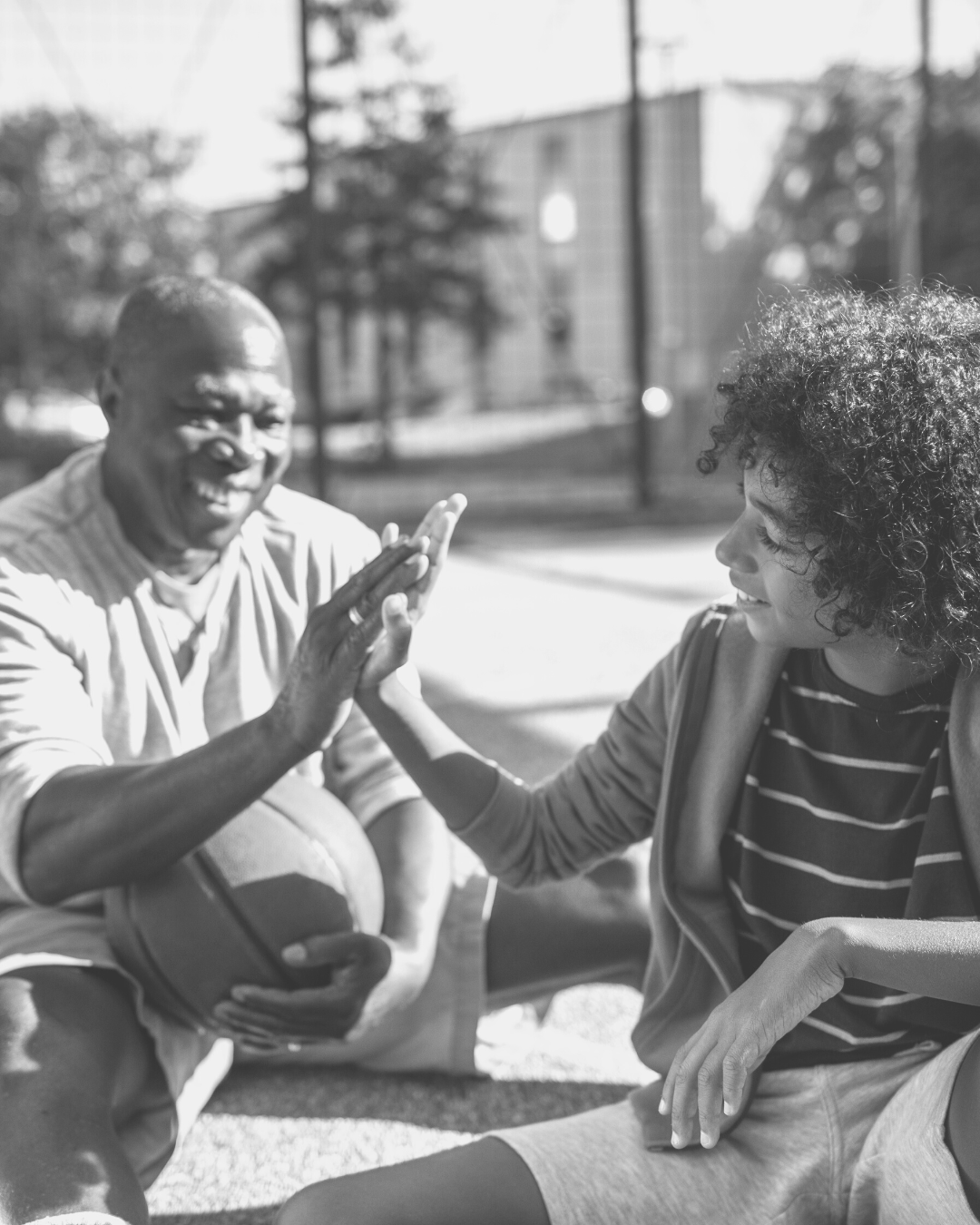 Mentor and mentee high fiving