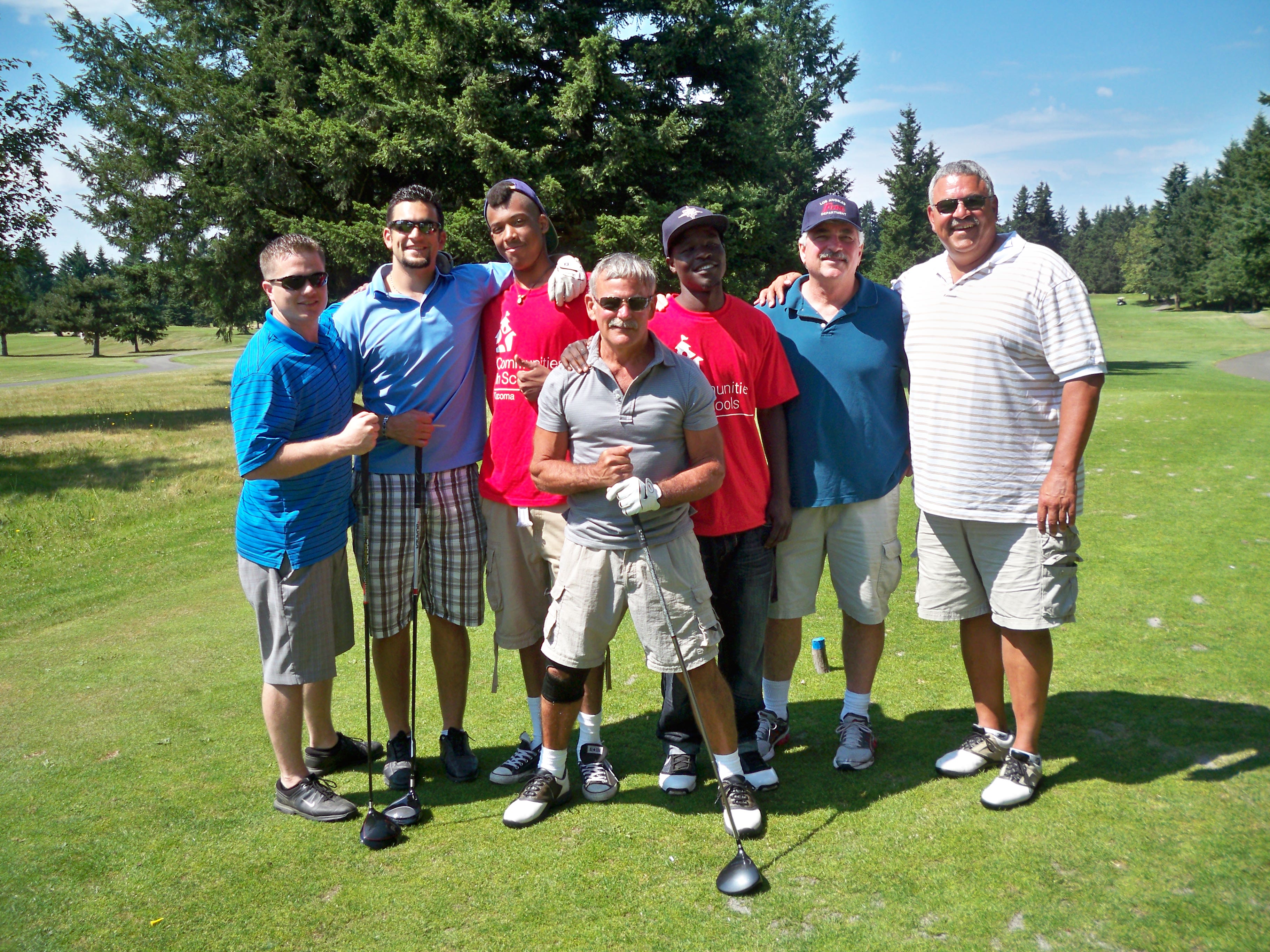 students with golfers