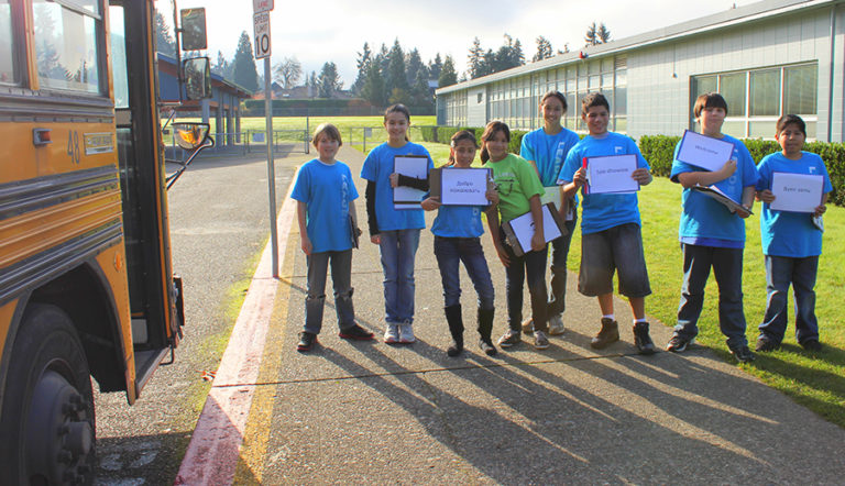 Children getting on to a school bus