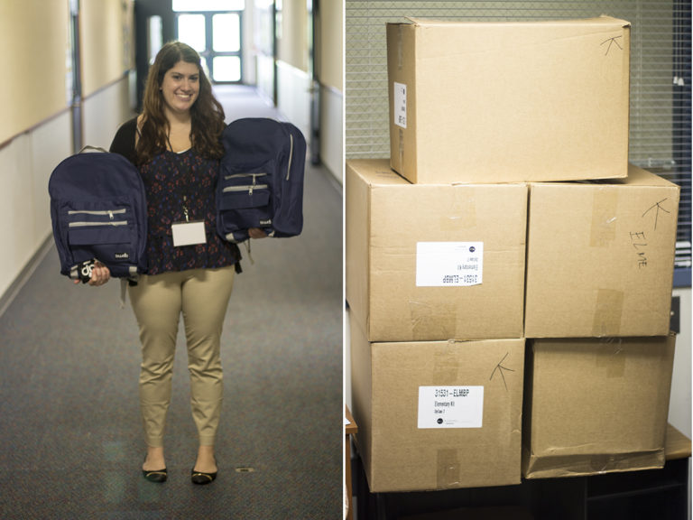 Communities In Schools of Kent Site Coordinator Jessica Cohen receives 42 stuffed backpacks from Boeing